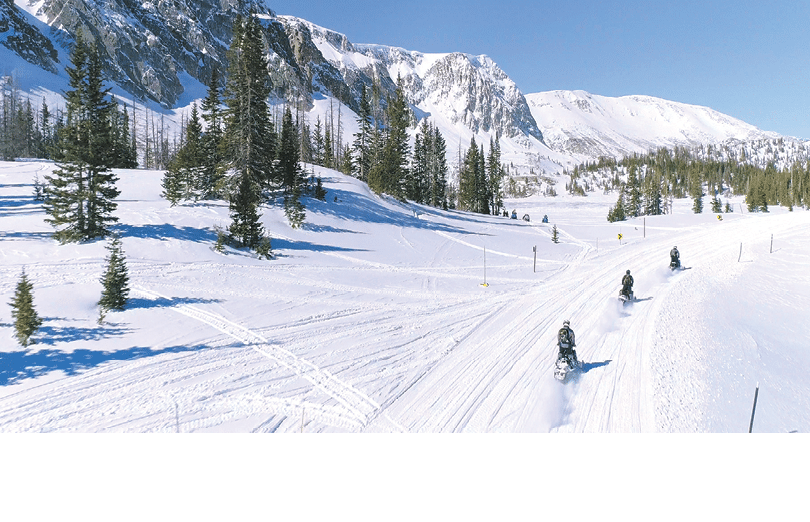 A snowy mountain with a group of people skiing down the slope. AI generated content